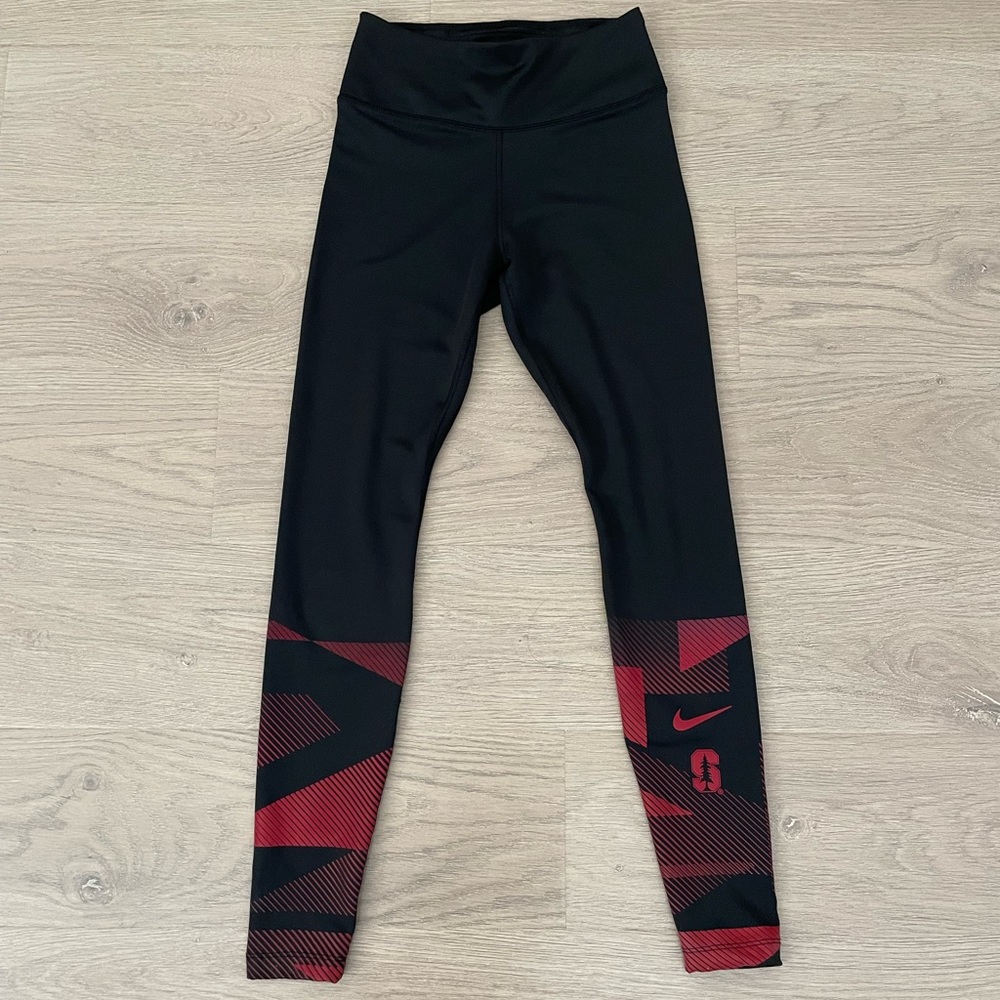 Nike women dri fit leggings with red graphics on the bottom.